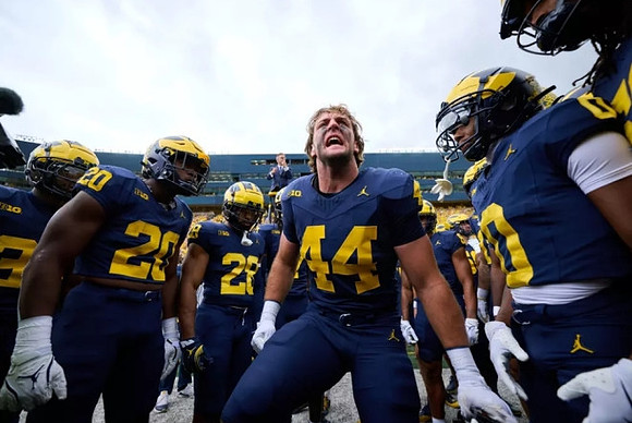 Max Bredeson (44) and Michigan Team