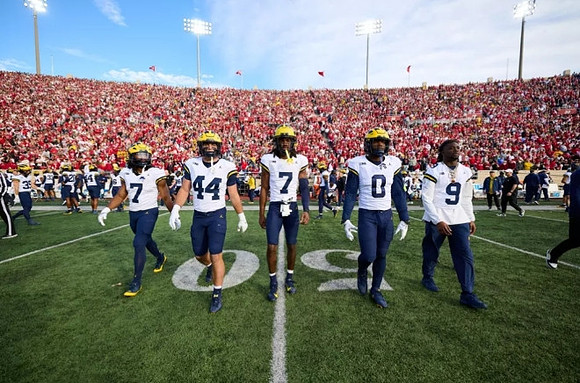 Donovan Edwards (7), Max Bredeson (44), Makari Paige (7), Josaiah Stewart (0), and Rod Moore (9)