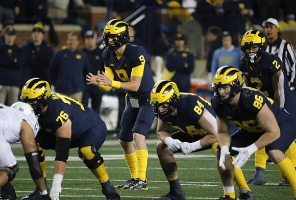 Ryan Hayes (76), J.J. McCarthy (9), Joel Honigford (84), Luke Schoonmaker (86), and Blake Corum (2)