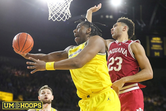 Hunter Dickinson (1) and Tarris Reed Jr. (32)