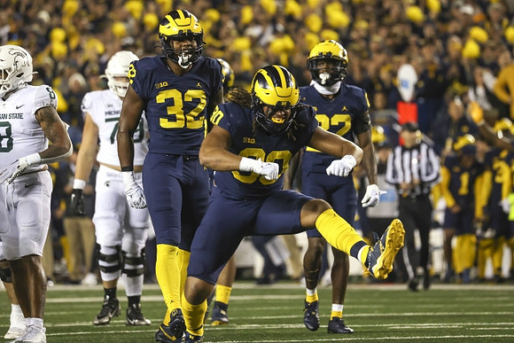 Jaylen Harrell (32), Mike Morris (90), and Gemon Green (22)