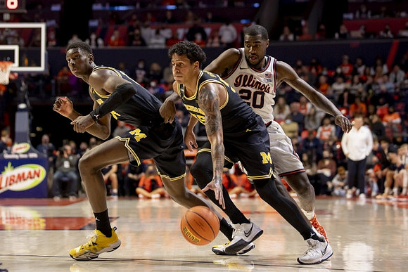 Moussa Diabate (14) and Eli Brooks (55)