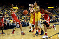 D.J. Wilson (5) and Moritz Wagner (13)