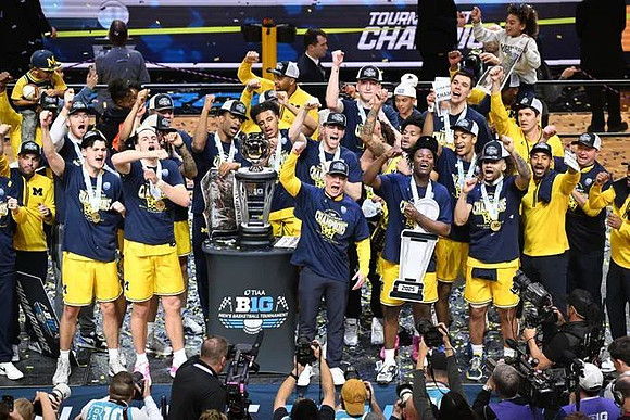 Dusty May, Michigan Team, and Big Ten Tournament Championship Trophy
