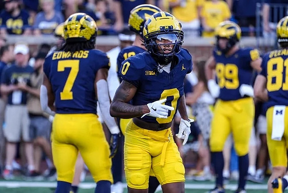 Donovan Edwards (7) and Semaj Morgan (0)