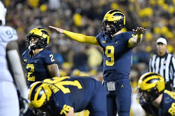 Blake Corum (2), Ryan Hayes (76), and J.J. McCarthy (9)