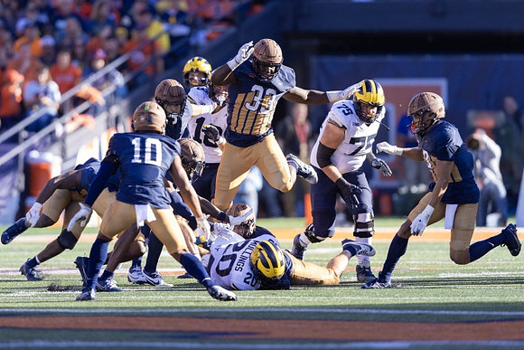 Colston Loveland (18), Kalel Mullings (20), and Andrew Gentry (75)