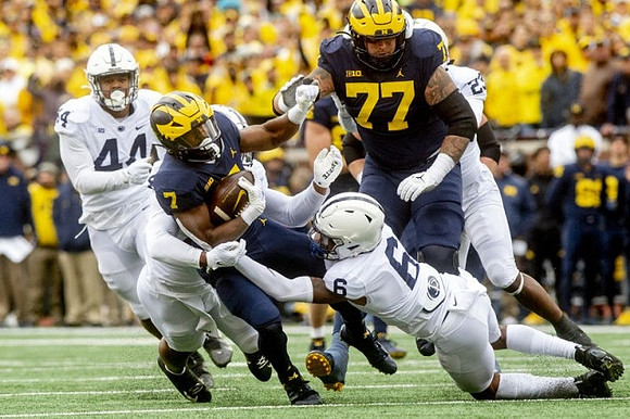 Donovan Edwards (7) and Trevor Keegan (77)