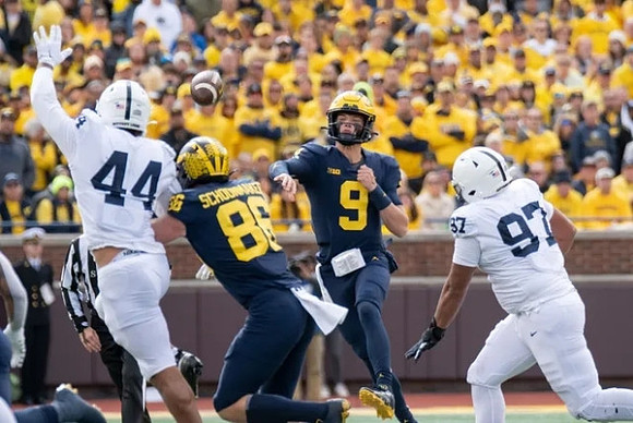 Luke Schoonmaker (86) and J.J. McCarthy (9)