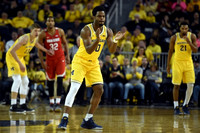 Moritz Wagner (13), Derrick Walton Jr. (10), and Zak Irvin (21)
