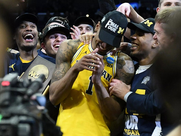 Charles Matthews (1), Michigan Team, and West Regional Championship Trophy