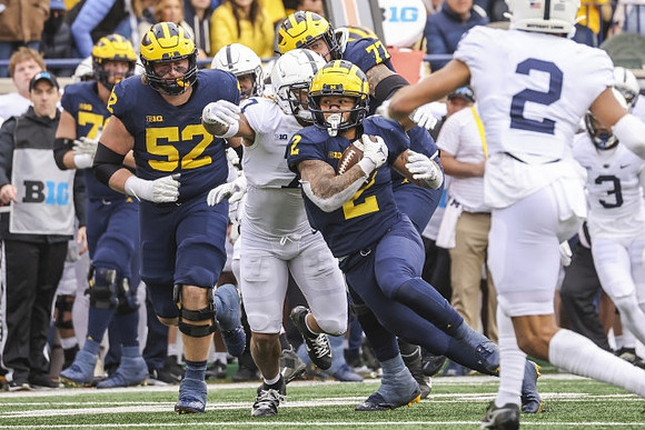 Karsen Barnhart (52), Blake Corum (2), and Trevor Keegan (77)