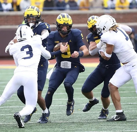 Andrel Anthony (1), J.J. McCarthy (9), and Ronnie Bell (8)