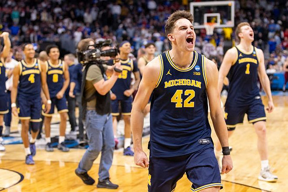 Will Tschetter (42) and Michigan Team