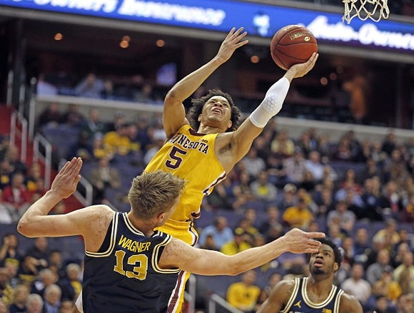 Moritz Wagner (13) and Derrick Walton Jr. (10)