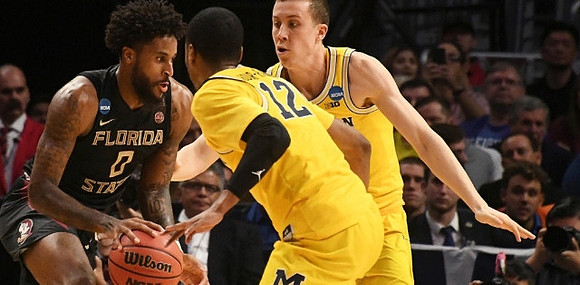 Muhammad-Ali Abdur-Rahkman (12) and Duncan Robinson (22)