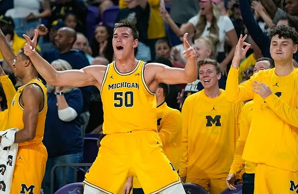 Vladislav Goldin (50) and Michigan Team