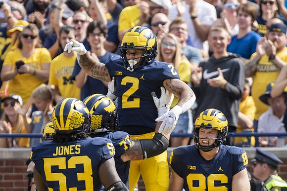 Trente Jones (53), Trevor Keegan (77), Blake Corum (2), and Luke Schoonmaker (86)