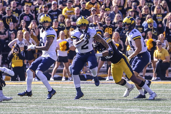 Ronnie Bell (8), Blake Corum (2), and Roman Wilson (14)