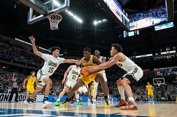 Moussa Diabate (14), Terrance Williams II (5), and Caleb Houstan (22)