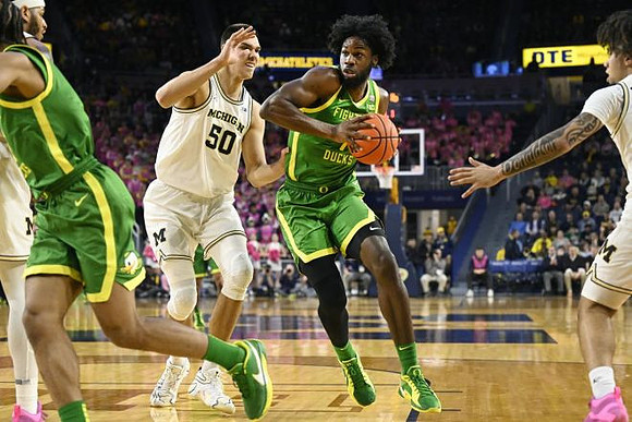 Roddy Gayle Jr. (11), Vladislav Goldin (50), and Tre Donaldson (3)