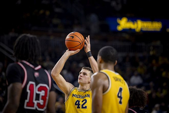 Will Tschetter (42) and Nimari Burnett (4)
