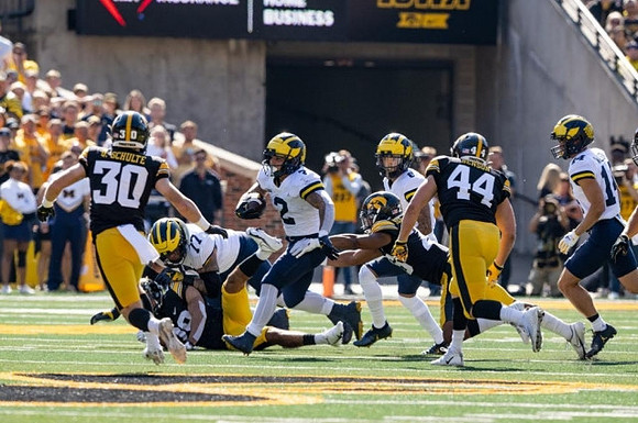 Trevor Keegan (77), Blake Corum (2), J.J. McCarthy (9), and Roman Wilson (14)