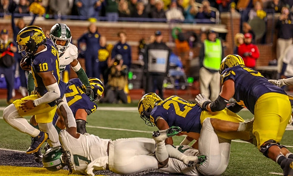 Alex Orji (10), Evan Link (71), and Kalel Mullings (20)