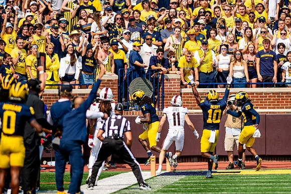 Makari Paige (7), Zeke Berry (10), and Jyaire Hill (20)