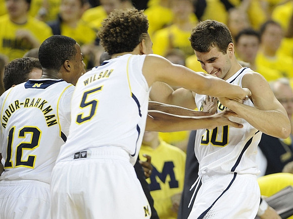 Muhammad-Ali Abdur-Rahkman (12), D.J. Wilson (5), and Austin Hatch (30)