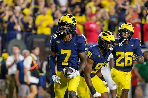 Makari Paige (7), Cameron Brandt (91), and Quinten Johnson (28)
