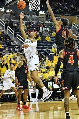 Kobe Bufkin (2) and DeVante' Jones (12)