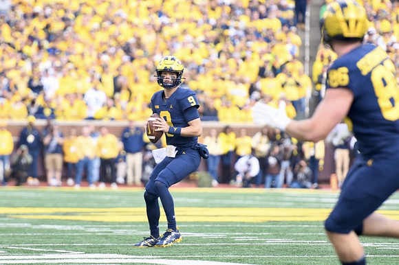 J.J. McCarthy (9) and Luke Schoonmaker (86)