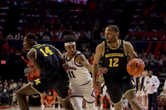 Moussa Diabate (14) and DeVante' Jones (12)