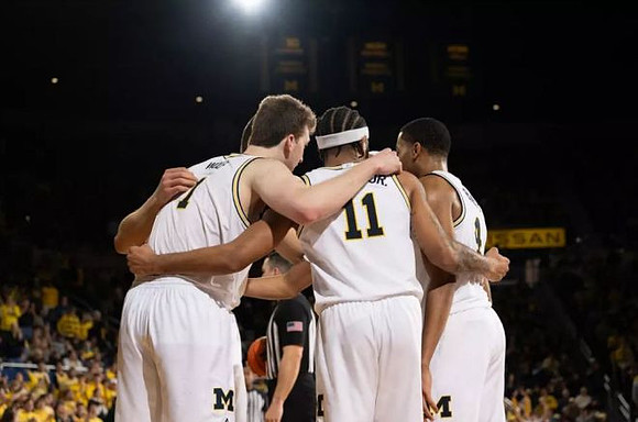 Danny Wolf (1), Roddy Gayle Jr. (11), and Nimari Burnett (4)