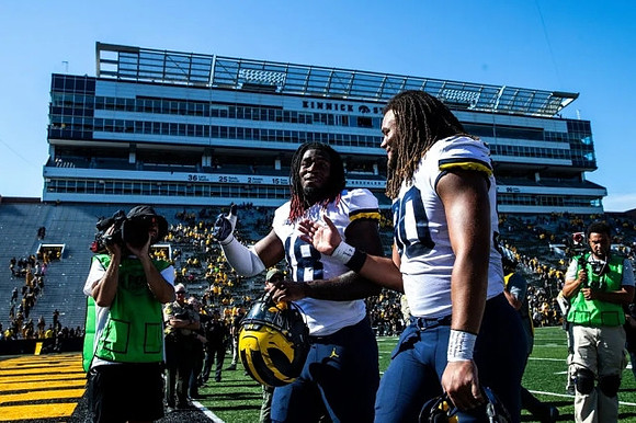 Eyabi Anoma Okie (18) and Mike Morris (90)