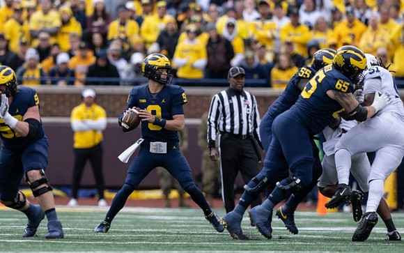 Karsen Barnhart (52), J.J. McCarthy (9), Olusegun Oluwatimi (55), and Zak Zinter (65)