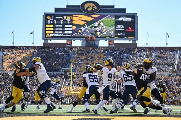 Luke Schoonmaker (86), Olusegun Oluwatimi (55), J.J. McCarthy (9), Zak Zinter (65), and Trente Jones (53)