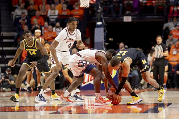 Moussa Diabate (14) and DeVante' Jones (12)