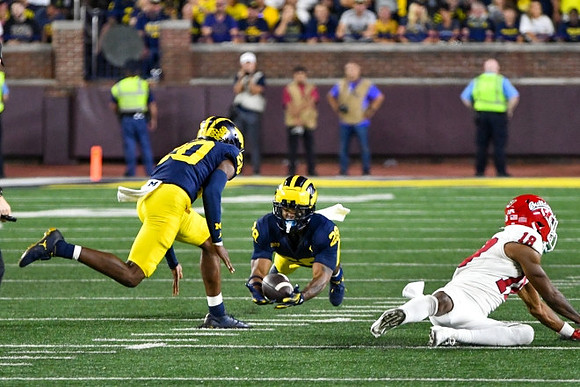 Jyaire Hill (20) and Quinten Johnson (28)