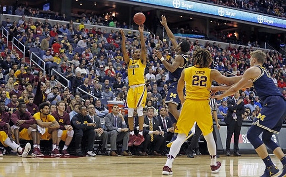 Derrick Walton Jr. (10), Moritz Wagner (13), and Minnesota Head Coach Richard Pitino