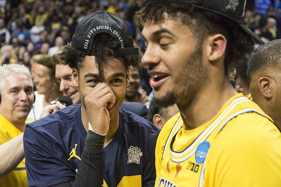 Jordan Poole (2) and Isaiah Livers (4)
