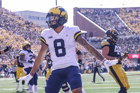 Blake Corum (2) and Ronnie Bell (8)