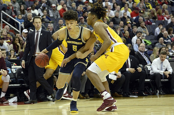 Minnesota Head Coach Richard Pitino and D.J. Wilson (5)