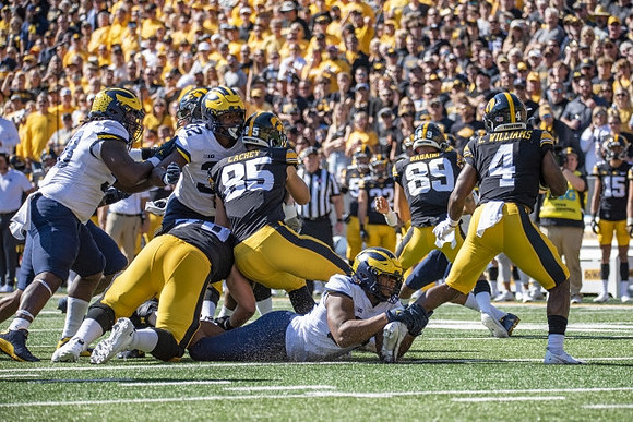 Mazi Smith (58), Jaylen Harrell (32), and Junior Colson (25)