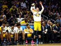 Moritz Wagner (13) and Michigan Team