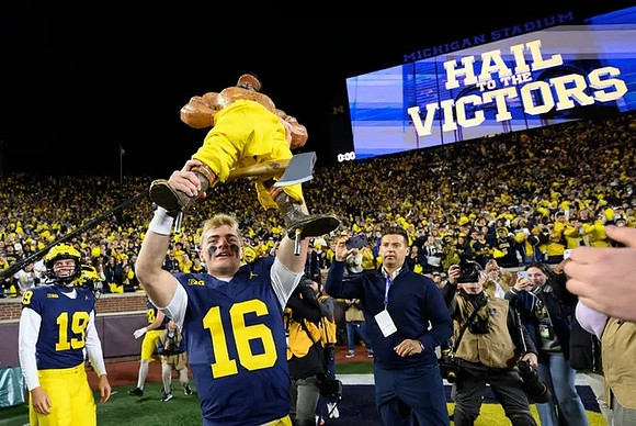 Tommy Doman (19), Davis Warren (16), and Paul Bunyan Trophy