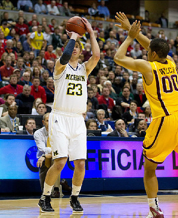 Evan Smotrycz (23) and John Beilein