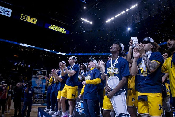 Dusty May, Michigan Team, and Big Ten Tournament Championship Trophy