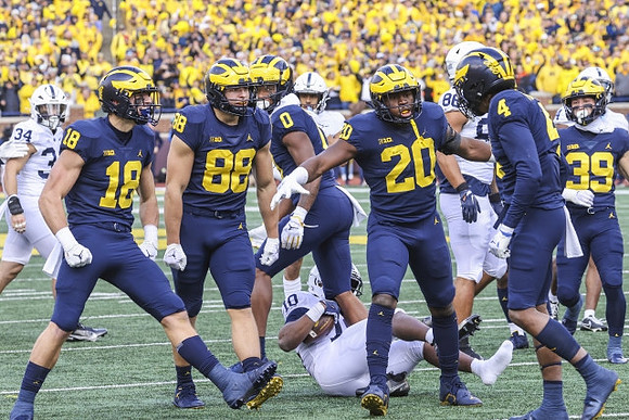 Colston Loveland (18), Matthew Hibner (88), Darrius Clemons (0), Kalel Mullings (20), Micah Pollard (4), and Joe Taylor (39)